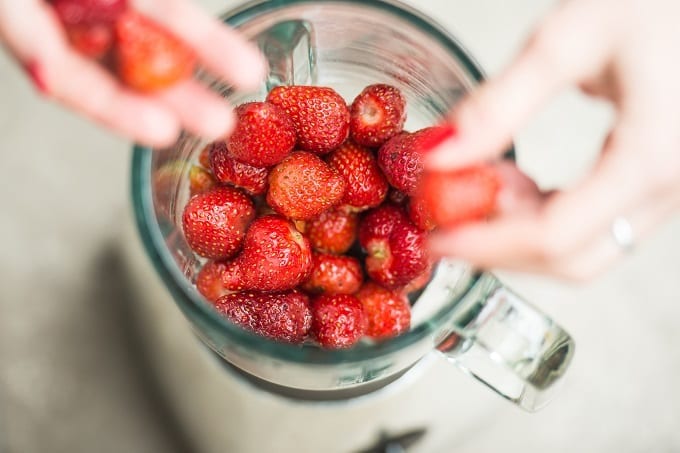 Putting Strawberries In Blender